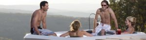 Four people enjoying Bullfrog Spa in a Mountain setting