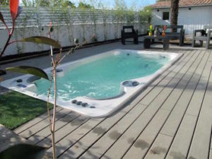 AquaSport 14fX Swim Spa In Backyard Deck in Maine