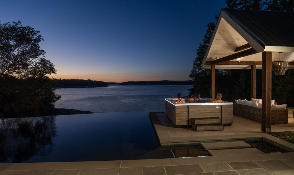 couple at sunset enjoying the quiet evening in Maine in they Bullfrog Spa